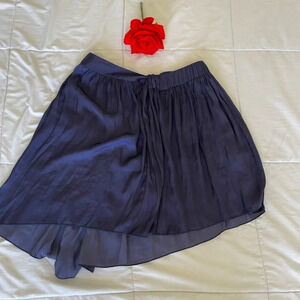 Raquel Allegra purple pleated mini skirt